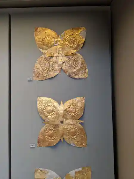 Ancient gold floral ornaments arranged in cross shape for decorating wealthy religious garments